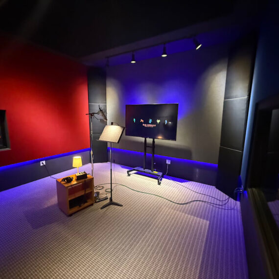 Dialogue recording room with 14 by 15 foot recording space, 11 foot ceiling height, remote streaming, and premium voice microphones