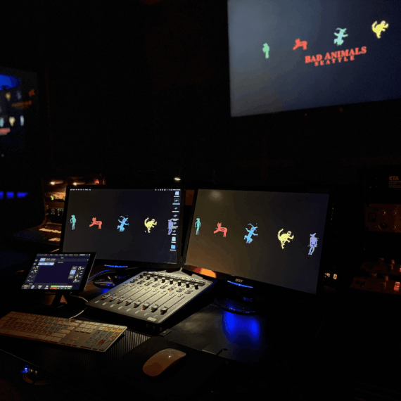 Professional audio post production mix room with Source Connect, Source Nexus, remote connection, and seating for up to seven people