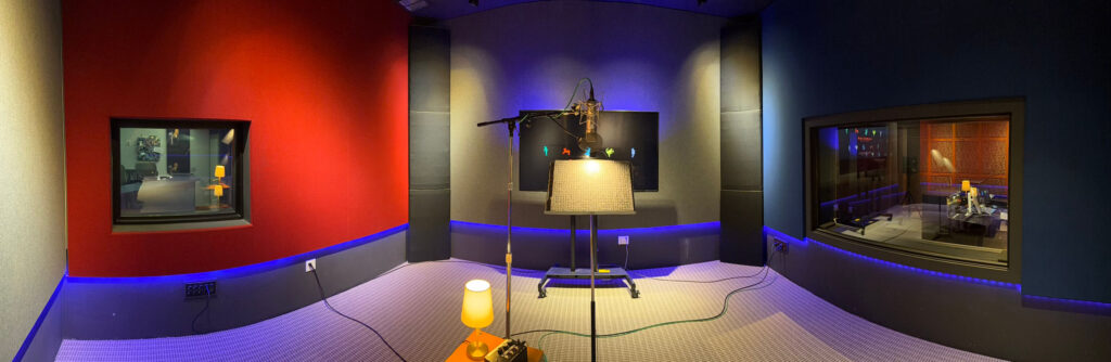 Professional voice recording room with 11 foot ceilings, remote camera streaming, 70 inch HD display, and premium microphones